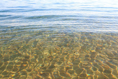 Blue clear water. Sea, lake, sun, beach, vacation Background for inserting images and text. Tourism,...