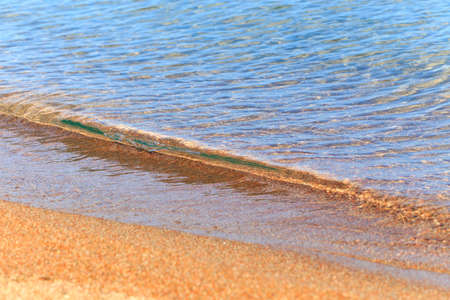 Blue clear water. Sea, lake, sun, beach, vacation Background for inserting images and text. Tourism, travel.の写真素材