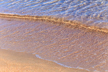 Blue clear water. Sea, lake, sun, beach, vacation Background for inserting images and text. Tourism, travel.の写真素材