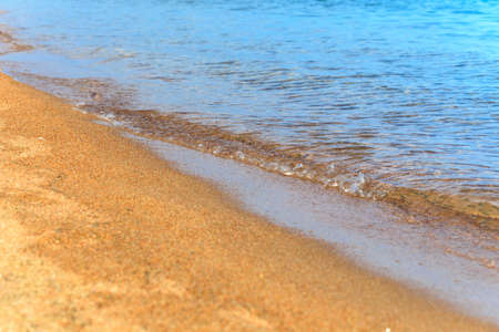 Blue clear water. Sea, lake, sun, beach, vacation Background for inserting images and text. Tourism, travel.の写真素材