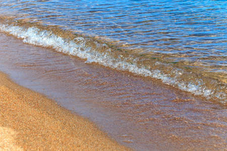Blue clear water. Sea, lake, sun, beach, vacation Background for inserting images and text. Tourism, travel.の写真素材