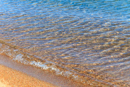 Blue clear water. Sea, lake, sun, beach, vacation Background for inserting images and text. Tourism, travel.の写真素材