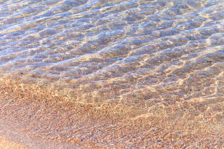 Blue clear water. Sea, lake, sun, beach, vacation Background for inserting images and text. Tourism, travel concept photoの写真素材