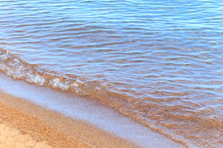 Blue clear water. Sea, lake, sun, beach, vacation Background for inserting images and text. Tourism, travel.の写真素材