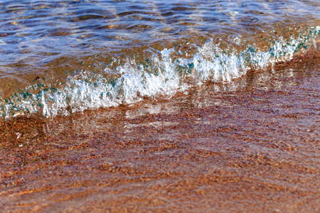 Blue clear water. Sea, lake, sun, beach, vacation Background for inserting images and text. Tourism, travel concept photoの写真素材