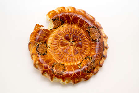 Baked round traditional Asian tandoor bread isolated on white background. Orient, asian, indian cuisine.の写真素材