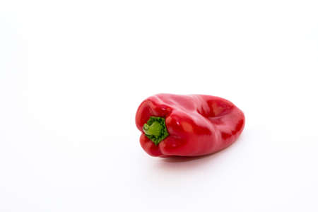Red pepper on white background. Natural farm product. Image for cafe advertising, food.の写真素材