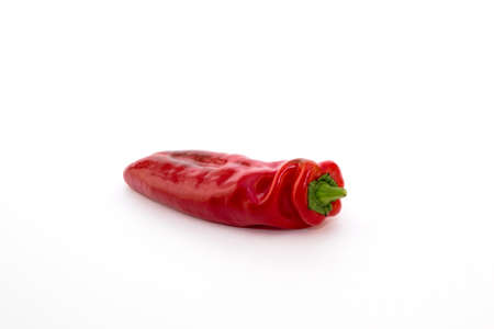 Red pepper on white background. Natural farm product. Image for cafe advertising, food.の写真素材