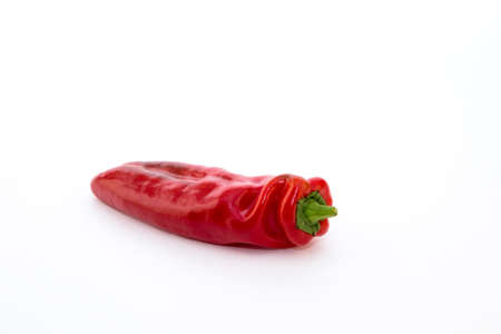 Red pepper on white background. Natural farm product. Image for cafe advertising, food.の写真素材