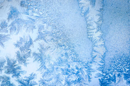 Winter ice pattern on the frozen window. Texture, background for inserting text. New Year theme. Winter. Cold.の写真素材