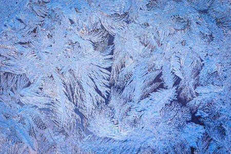 Winter ice pattern on the frozen window. Texture, background for inserting text. New Year theme. Winter. Cold.の写真素材