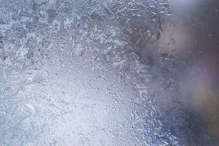 Winter ice pattern on the frozen window. Texture, background for inserting text. New Year theme. Winter. Cold.の写真素材