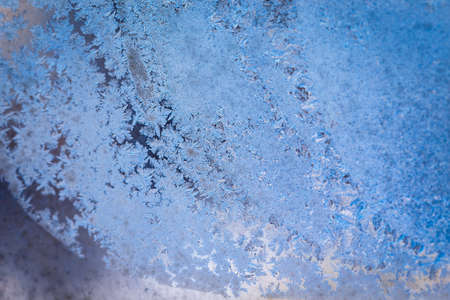 Winter ice pattern on the frozen window. Texture, background for inserting text. New Year theme. Winter. Cold.の写真素材