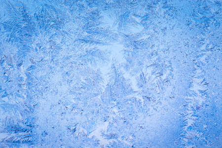 Winter ice pattern on the frozen window. Texture, background for inserting text. New Year theme. Winter. Cold.の写真素材