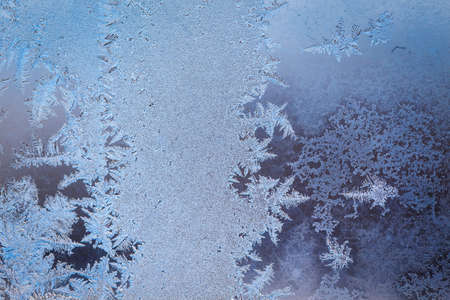 Winter ice pattern on the frozen window. Texture, background for inserting text. New Year theme. Winter. Cold.の写真素材