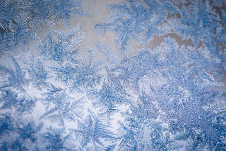 Winter ice pattern on the frozen window. Texture, background for inserting text. New Year theme. Winter. Cold.の写真素材
