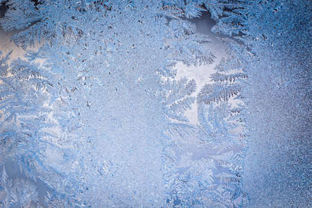Winter ice pattern on the frozen window. Texture, background for inserting text. New Year theme. Winter. Cold.の写真素材