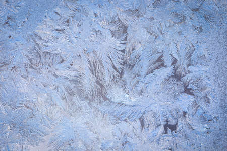 Winter ice pattern on the frozen window. Texture, background for inserting text. New Year theme. Winter. Cold.の写真素材