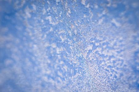 Winter ice pattern on the frozen window. Texture, background for inserting text. New Year theme. Winter. Cold.の写真素材