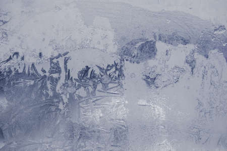 Winter ice pattern on the frozen window. Texture, background for inserting text. New Year theme. Winter. Cold.の写真素材