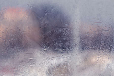 Winter ice pattern on the frozen window. Texture, background for inserting text. New Year theme. Winter. Cold.の写真素材