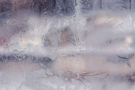 Winter ice pattern on the frozen window. Texture, background for inserting text. New Year theme. Winter. Cold.の写真素材