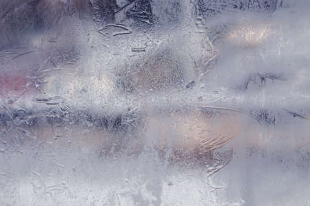 Winter ice pattern on the frozen window. Texture, background for inserting text. New Year theme. Winter. Cold.の写真素材