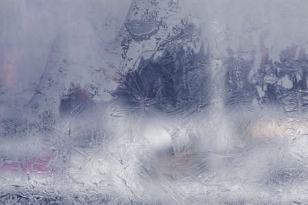 Winter ice pattern on the frozen window. Texture, background for inserting text. New Year theme. Winter. Cold.の写真素材