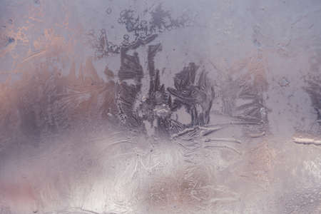 Winter ice pattern on the frozen window. Texture, background for inserting text. New Year theme. Winter. Cold.の写真素材