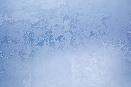Winter ice pattern on the frozen window. Texture, background for inserting text. New Year theme. Winter. Cold.の写真素材