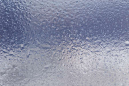 Winter ice pattern on the frozen window. Texture, background for inserting text. New Year theme. Winter. Cold.の写真素材