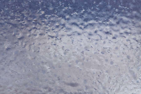 Winter ice pattern on the frozen window. Texture, background for inserting text. New Year theme. Winter. Cold.の写真素材