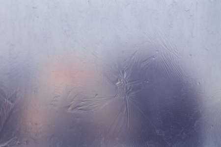 Winter ice pattern on the frozen window. Texture, background for inserting text. New Year theme. Winter. Cold.の写真素材