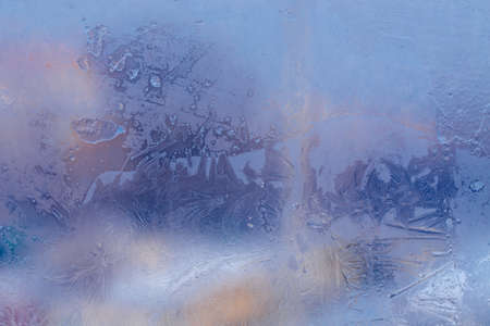 Winter ice pattern on the frozen window. Texture, background for inserting text. New Year theme. Winter. Cold.の写真素材