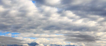 Blue sky with white cumulus clouds. Abstract natural background.の写真素材