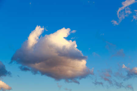 Blue sky with white cumulus clouds. Abstract natural background.