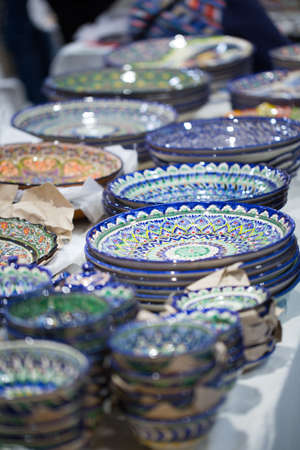 Bright oriental colored plates. Authentic dishes hand-painted in national style. Beautiful bowls and...