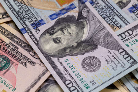Background of dollar bills. American Dollars Cash Money. One hundred dollars, fifty dollars, ten...