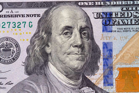 Closeup of a hundred dollar bill. Background of dollar bills. American Dollars Cash Money. Benjamin...