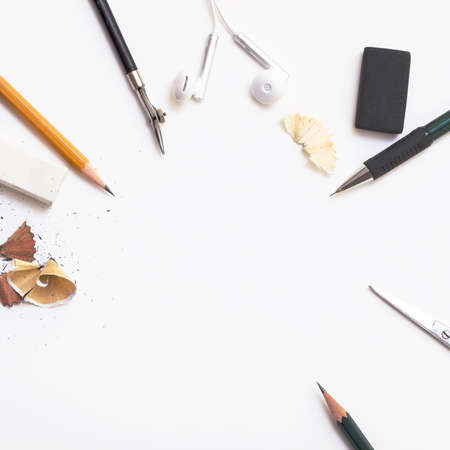 Background with white paper, pencils and eraser. Workplace for the painter. Background to display the logo and lettering. copyspace, space for text. the blogger instrument.の写真素材