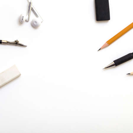 Background with white paper, pencils and eraser. Workplace for the painter. Background to display the logo and lettering. copyspace, space for text. the blogger instrument.の写真素材