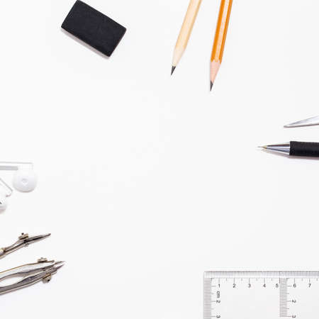 Background with white paper, pencils and eraser. Workplace for the painter. Background to display the logo and lettering. copyspace, space for text. the blogger instrument.の写真素材
