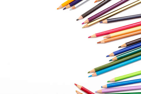 Colour pencils isolated on white background. Wood texture pencil with sharpening shavings on white...