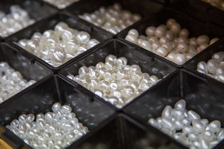 pearl beads. Material for handmade jewelery. Background for the store and the master. Shop for creativity.の写真素材