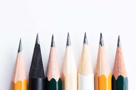 Background with white paper and pencils. Workplace for the artist and illustrator. Background to display the logo and lettering. copyspace, space for text. Office tools.の写真素材