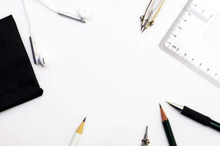 Background with white paper, pencils and eraser. Workplace for the painter. Background to display...
