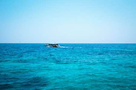 National park, beautiful blue sea. White boats with tourists.の写真素材