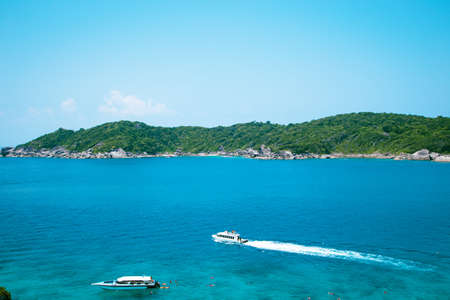 National park, beautiful blue sea. White boats with tourists.の写真素材