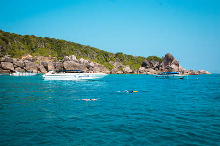 National park, beautiful blue sea. White boats with tourists.の写真素材