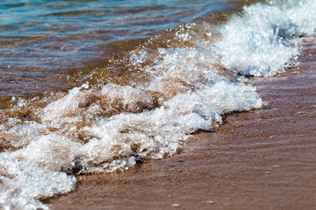 sandy beach and blue sea wave. Beautiful natural background. Tourism and travelの写真素材